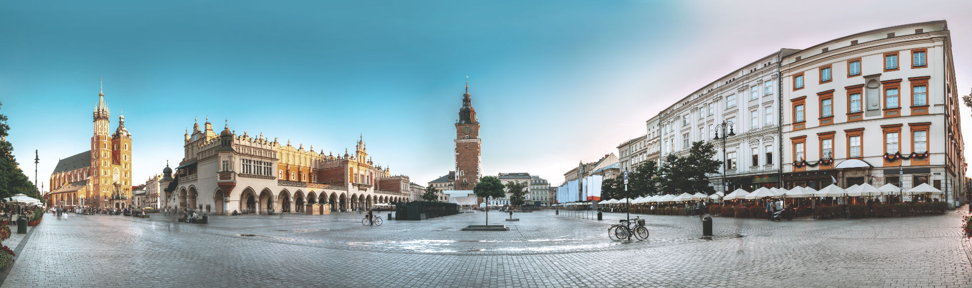 Krakow, Poland. Landmarks On Old Town Square In Summer Evening.